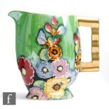 Carlton Ware - An Art Deco Moderne shape jug decorated in the Hollyhocks pattern, printed script