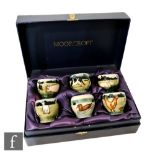 Anji Davenport - Moorcroft Pottery - A cased set of six eggcups each decorated with a tubelined farm