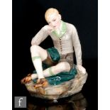 Wolf & Co - An Austrian model of a young boy dressed in his national costume sat on a green