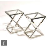 Eichholtz - A pair of 'Criss Cross high steel' side tables, the X frame aluminium table with upper