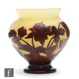 Galle - An early 20th Century French cameo glass vase of baluster form with everted rim, cased in