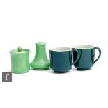 Ruskin Pottery - A pepper pot and lidded mustard both decorated in an apple green lustre, tallest