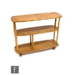 Lucian Ercolani for Ercol Furniture - A model 361 blonde elm and beech trolley bookcase, the three