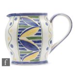 E Radford - A ceramic jug of ovoid form with loop handle, decorated with stylised leaves in blue and