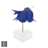 Kjell Engman - Kosta Boda - A glass figure modelled as a stylised blue cow, raised to a frosted