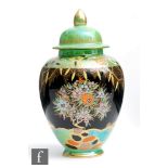Carlton Ware - A 1930s Art Deco vase and cover decorated in the Mandarin Tree pattern, printed