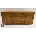 Lucian Ercolani for Ercol Furniture - A Windsor blonde elm sideboard, model 455, fitted with an
