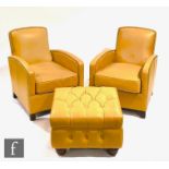 Timothy Oulton - A pair of mustard leather studded armchairs on dark wood block feet, each bearing