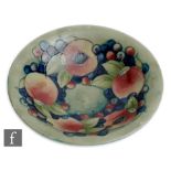 William Moorcroft - An early 20th Century wide brim bowl decorated in the Pomegranate pattern with a