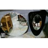 Unknown - A 1950s Art Deco style wall mirror, oval with facet cut detailing to the top attached to a
