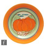 Clarice Cliff - Orange Lily - A circular side plate circa 1929, hand painted with a large stylised