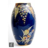 Carlton Ware - A large Art Deco vase of swollen form decorated in the Devils Copse pattern,