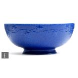 Ruskin Pottery - A crystalline glaze footed bowl decorated in an all over blue glaze with moulded