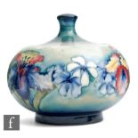 William Moorcroft - A 1930s/1940s powder bowl and cover decorated in the Frilled Orchid pattern with