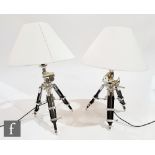 Eichholtz - A pair of 'Royal Marine' table lamps, the black and chrome splayed legs with moveable