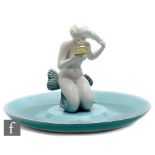 Ronzan - An Italian model of a nude mermaid looking at her reflection in a mirror within a large