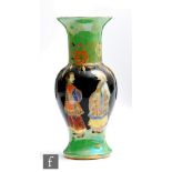 Carlton Ware - An Art Deco vase of flared baluster form decorated in the Mandarins Chatting pattern,
