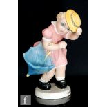 C.I.A Manna - A 1930s/1950s Italian model of a young girl walking in the wind, holding her hat to