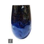 Strathearn - A later 20th Century ovoid form vase, the mottled light and dark blue swirling ground
