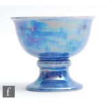 Ruskin Pottery - A small footed bowl decorated in an all over lavender lustre, impressed mark and