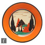 Clarice Cliff - Red Trees & House - A 9 inch circular plate circa 1930, hand painted with a stylised