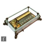 A post 1950s Swiss Reuge musical box seated in a glass case, playing three airs, William Tell, The
