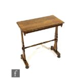 A small Victorian rosewood centre table on shaped end supports united by a turned stretcher, width