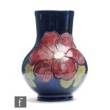 A small Moorcroft vase of globe and shaft form decorated in the Clematis pattern, impressed mark,