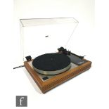 A Linn Sondek LP12 transcription turntable, with original perspex hood and teak mount, fitted with a