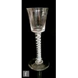 An 18th Century drinking glass circa 1770, the bucket form bowl above a double series opaque twist