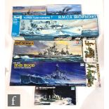 Five Tamiya 1:35 and 1:350 scale plastic model kits, ships and military related, to include 78010-