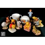 A collection of assorted Royal Doulton Winnie the Pooh figures comprising Winnie the Pooh and the