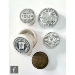 A pictorial Cherry tooth paste jar and lid by S M & Co, a Boots Areca nut lid, a Sapanaceous tooth