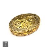 A 19th Century oval brass miners puzzle snuff box, the hinged top with four combination locks,