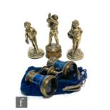 Three silver plated studies of standing cherubs tallest 12cm, with a pair of opera glasses. (4)