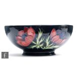 A Moorcroft Pottery footed bowl decorated in the Anemone pattern, impressed and painted marks,