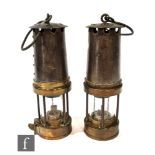 Two Patersons brass type A3 miners lamps, height 24cm. (2)