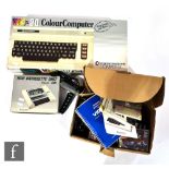 A boxed Commodore VIC-20, together with a boxed 1530 Datassette Unit, an unboxed joystick, and