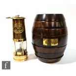A Remy Martin turned wood games compendium in the form of a seven sectional barrel and a polished