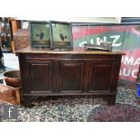 An 18th Century oak triple panelled coffer, the moulded edge top over a fielded panel front on