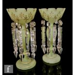 A pair of 19th Century green alabaster glass table lustre with circular foot, baluster column and