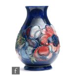 A Moorcroft vase of baluster form decorated in the Anemone pattern, impressed mark, height 13.5cm.