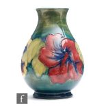 A Moorcroft vase of baluster form decorated in the Hibiscus pattern, impressed mark obscured by