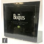 A Beatles box set of twenty four Limited Edition prints, published by Pyramid International,