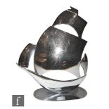 A 1930s chrome plated figure of a stylised galleon in full sale, raised on an oval plinth base,