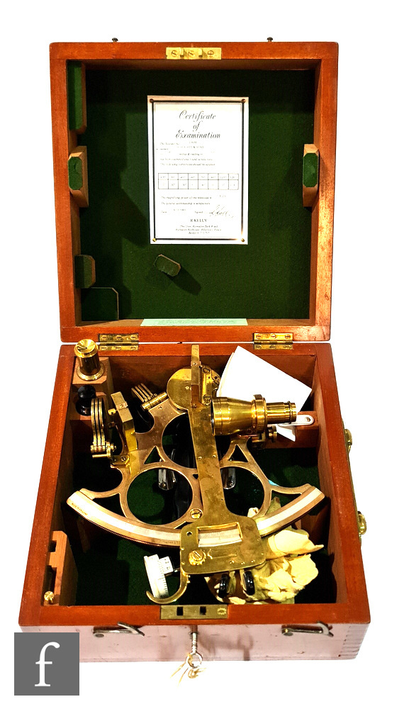 A 20th Century brass sextant by H Hughes & Son No 23639 in fitted mahogany case with key, width 26.