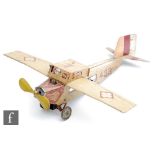A 1930s Georg Fischer tinplate clockwork aircraft, with printed detail in cream and red, numbered