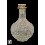 A late 19th Century crackle glass decanter of globe and shaft form with a flat rim and disc form