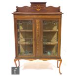 An Edwardian mahogany side display cabinet, the upright pediment inlaid with swagged garlands