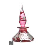 A 20th Century glass scent bottle of conical form with spire stopper, decorated with applied